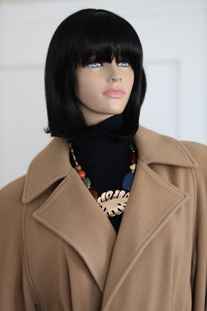 a mannequin wearing a coat